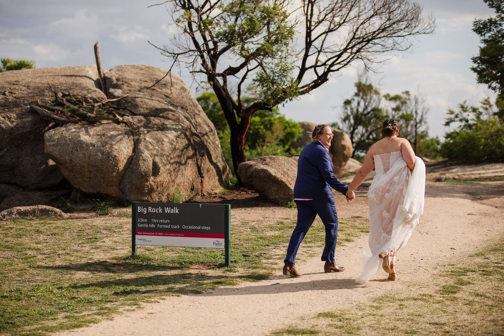 brides walking hand in hand at the You Yangs regional park