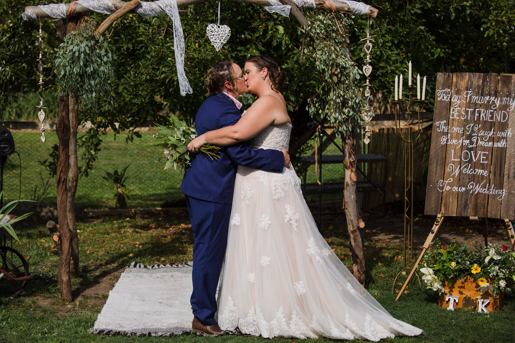 two brides sharing first kiss during covid 19 wedding elopement