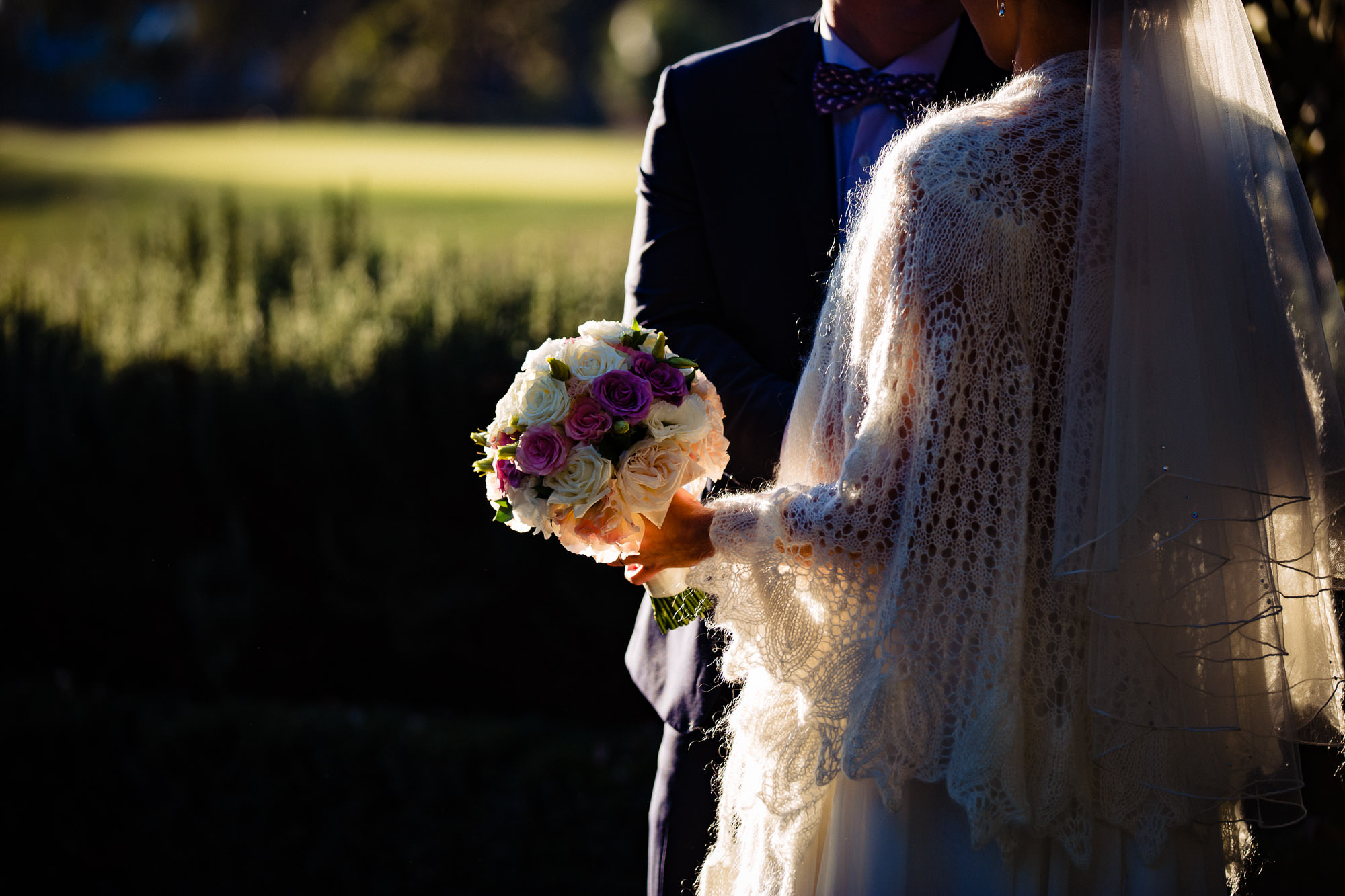brides and groom in the golden sunlight 